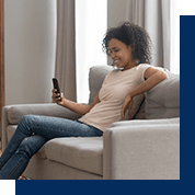 Woman on her phone on the couch